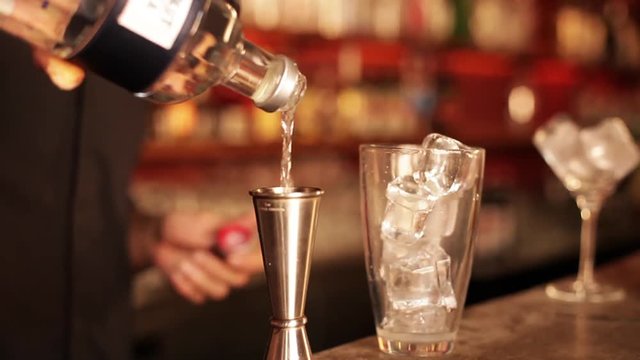 Bartender preparing cosmopolitan cocktail