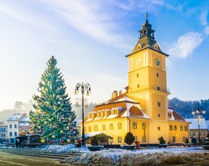 Christmas market and decorations tree in the main center of Brasov town, in winter season, Romania