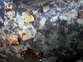Golden leaf on Buddha Statue