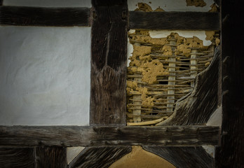 The old wall of the half timbered  farmhouse