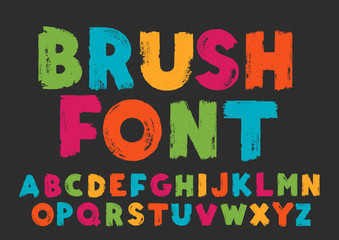 Color capital handwritten vector alphabet on black background. Drawn by semi-dry brush with unpainted areas.