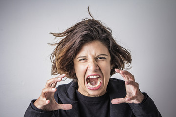 Furious angry woman screaming with rage and frustration