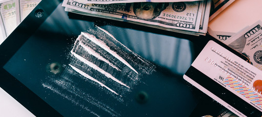 Cocaine Snorted Through Rolled 100 Dollar Banknote.  lifestyle of a drug addict.