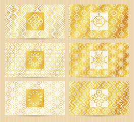 Business cards 3.5 x 2 inch size set with seamless geometric patterns and logo elements. Golden backgrounds and templates for any kind of your design.
