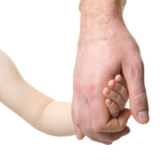 Father leads his child. Trust, family, assistance, parenting, childhood concept. Man's and kid's hands closeaup over white background.