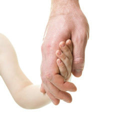 Father leads his child. Trust, family, assistance, parenting, childhood concept. Man's and kid's hands closeaup over white background.