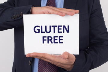Man showing paper with GLUTEN FREE text