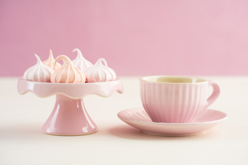 Tea time with pastels colored meringue kisses confectionary