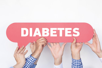 Group of people holding the DIABETES written speech bubble