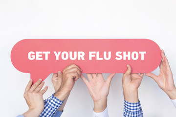 Group of people holding the GET YOUR FLU SHOT written speech bubble