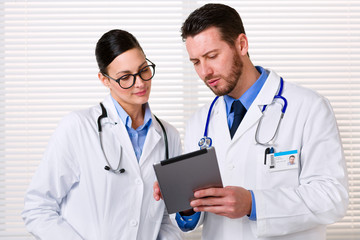 Doctors using tablet at work
