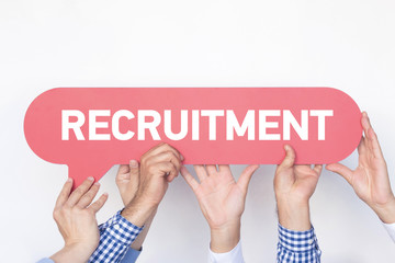 Group of people holding the RECRUITMENT written speech bubble