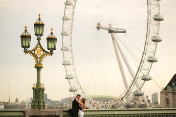 Groom and bride near London Eye