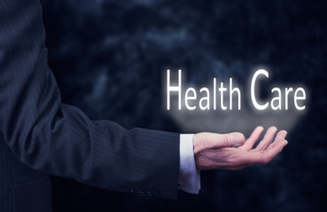 Hand holding a Health Care Concept.