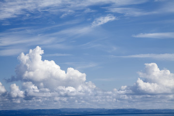 Naklejka na ściany i meble Suggestive view of an open blue sky and landscape horizon