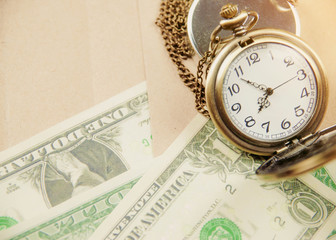 Money saving concept with vintage clock for the past.
