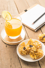 Cereals cracker snack and orange juice healthy on  table wood ba