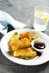 Fried fish stripes with bbq sauce