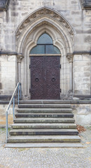 Fototapeta na wymiar Door in Stonewall of Medival Cathedral