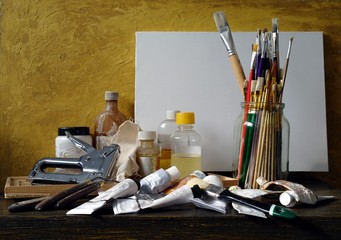 Still life in vintage style.Canvas,oil paints, paint brushes and solvent, tools of the painter