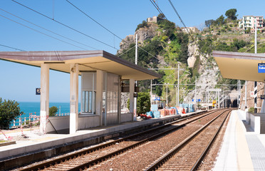 Naklejka premium CINQUE TERRE, ITALY - APRIL 7, 2013: Train along italian coast. The train is the best way to visit all Five Lands