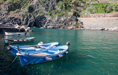 Fototapeta na wymiar Colorful boats in the quaint port of Vernazza, Cinque Terre - Italy