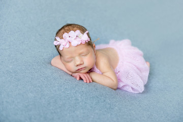 Baby girl sleeping on her tummy