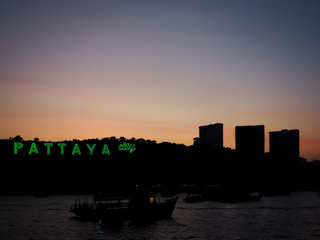 Pattaya city sign with silhouette background on sunset in pattaya thailand