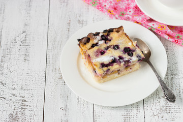 Cottage cheese casserole with peach and blueberry.