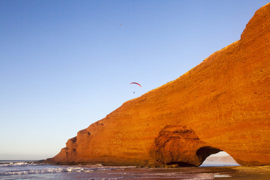 Seaside at Lezgira beach with paraglider, Morocco