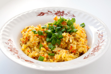 Plate of pilaf with green onions for lunch