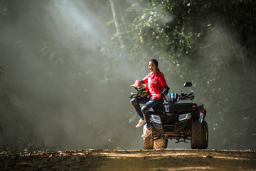 Woman going on a jungle zip line adventure, asia