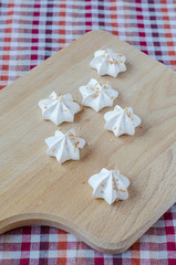 Sweet white meringue on cutting board.