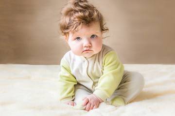 Fototapeta premium Beautiful little baby sitting.