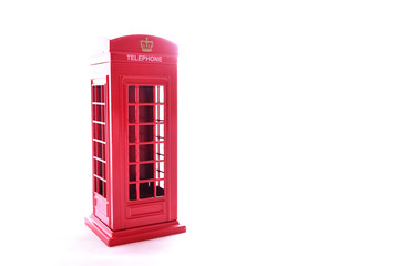 Classic British red phone booth on isolated white