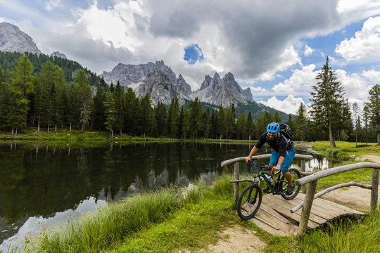 Mountain biking in the Dolomites, Misurina, Italy. Tre Cime di Lavaredo in background. © Gorilla