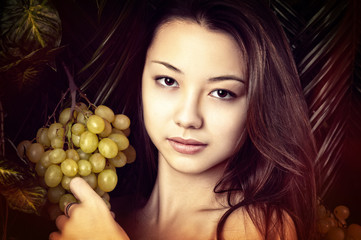 beautiful portrait girl with grapes