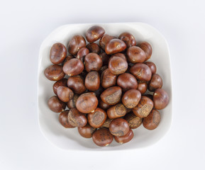 Obraz premium Chestnut on a white plate