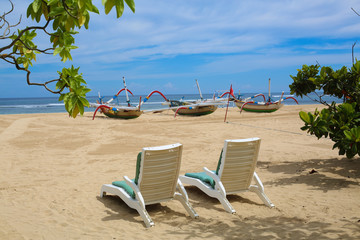 Two sun chairs on the beach