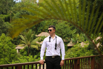 Handsome groom on the terrace, selective focus