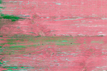 Old wooden background. Pink and green color