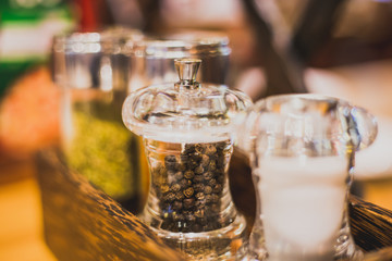 Fototapeta na wymiar Spices, black pepper in a glass jar.Soft focus