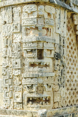 large masks of the Mayan god Chaac in the quadrangle of the nuns in the archaeological Uxmal enclosure in Yucatan, Mexico.