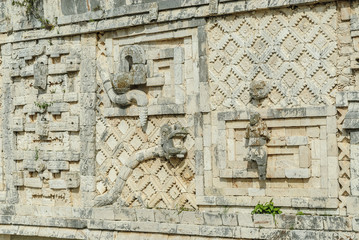 reliefs of the Mayan god kukulkan in the quadrangle of the nuns in the archaeological Uxmal enclosure in Yucatan, Mexico.
