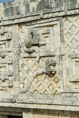 reliefs of the Mayan god kukulkan in the quadrangle of the nuns in the archaeological Uxmal enclosure in Yucatan, Mexico.