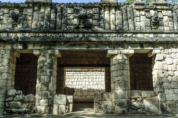 
building with ornamental reliefs in the Mayan archaeological Uxmal enclosure in Yucatan, Mexico.