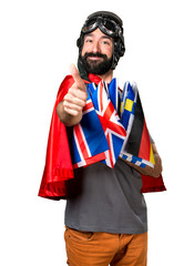 Superhero with a lot of flags with thumb up