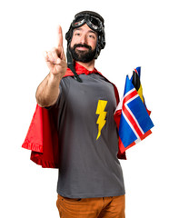 Superhero with a lot of flags touching on transparent screen