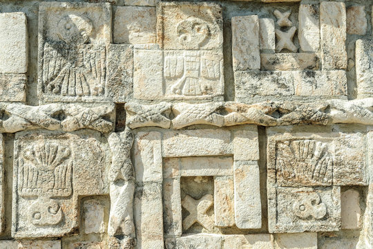 detail of the reliefs of the temple of the big Mayan pyramid in the archaeological Uxmal enclosure in yucatan, Mexico