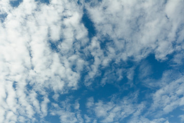 Fuzzy cloud in blue sky